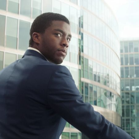 T'Challa wears a suit for conference